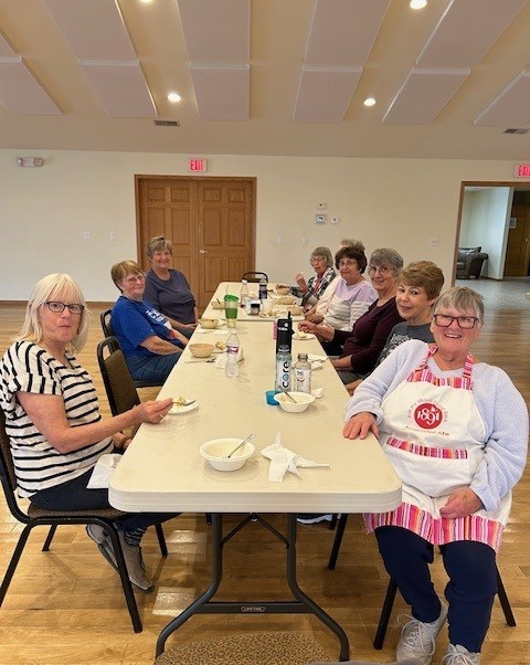 Impact Team 1181 take a break while making delicious kolaches for fundraiser